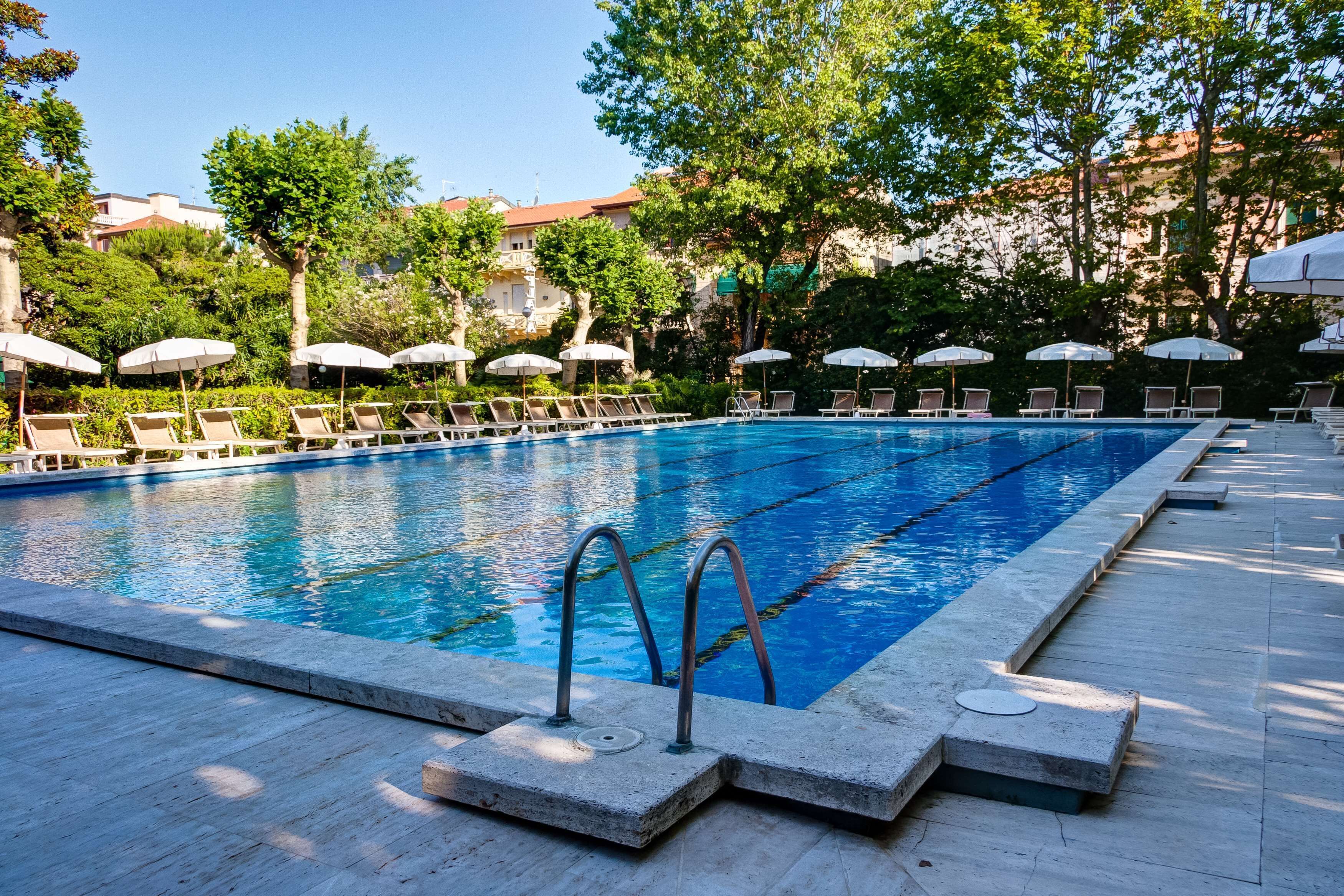 seasonal outdoor pool, open 10:00 am to 6:00 pm, pool umbrellas