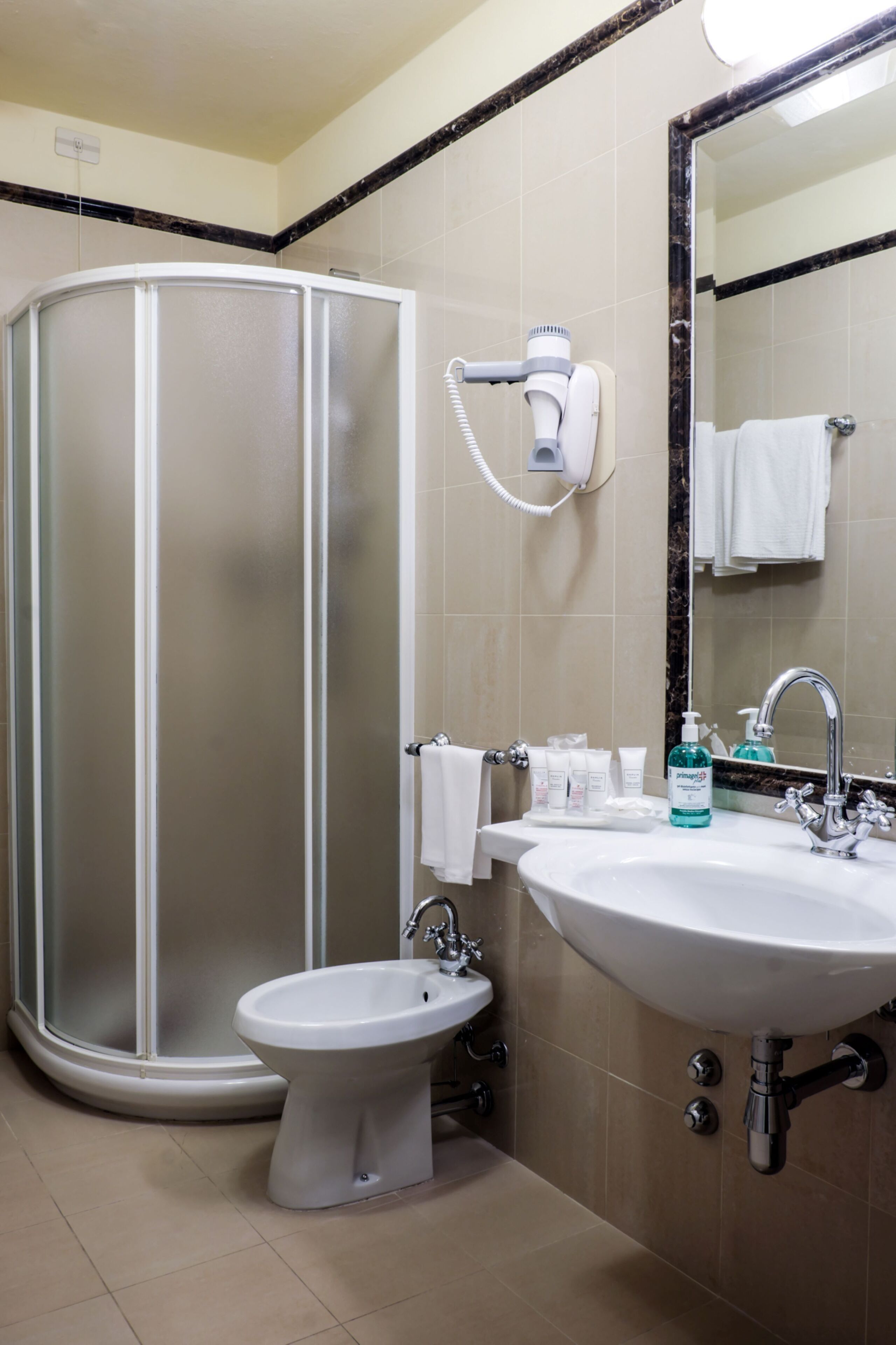 hair dryer, slippers, towels, soap