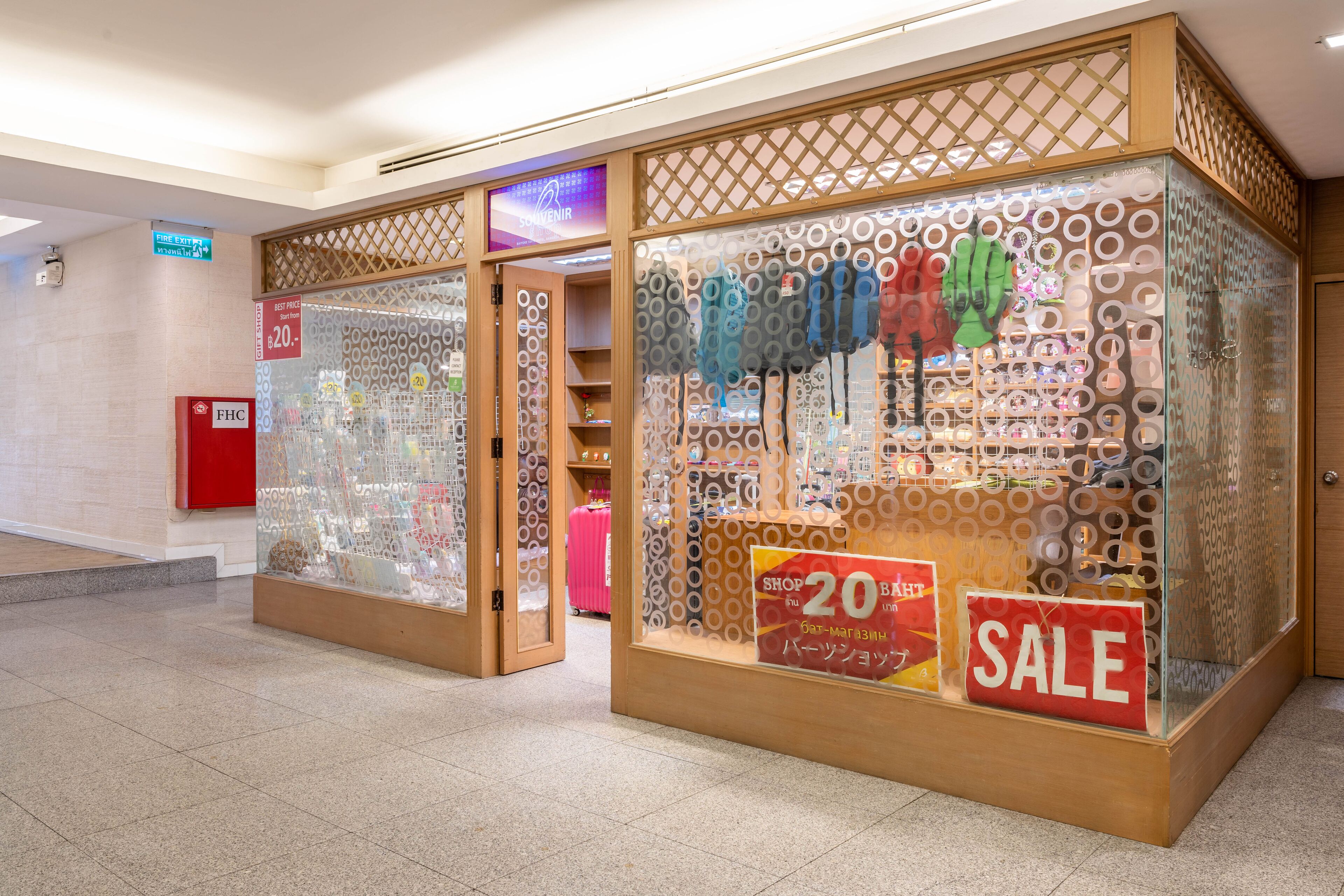 A store with a sale sign and a display of various items.