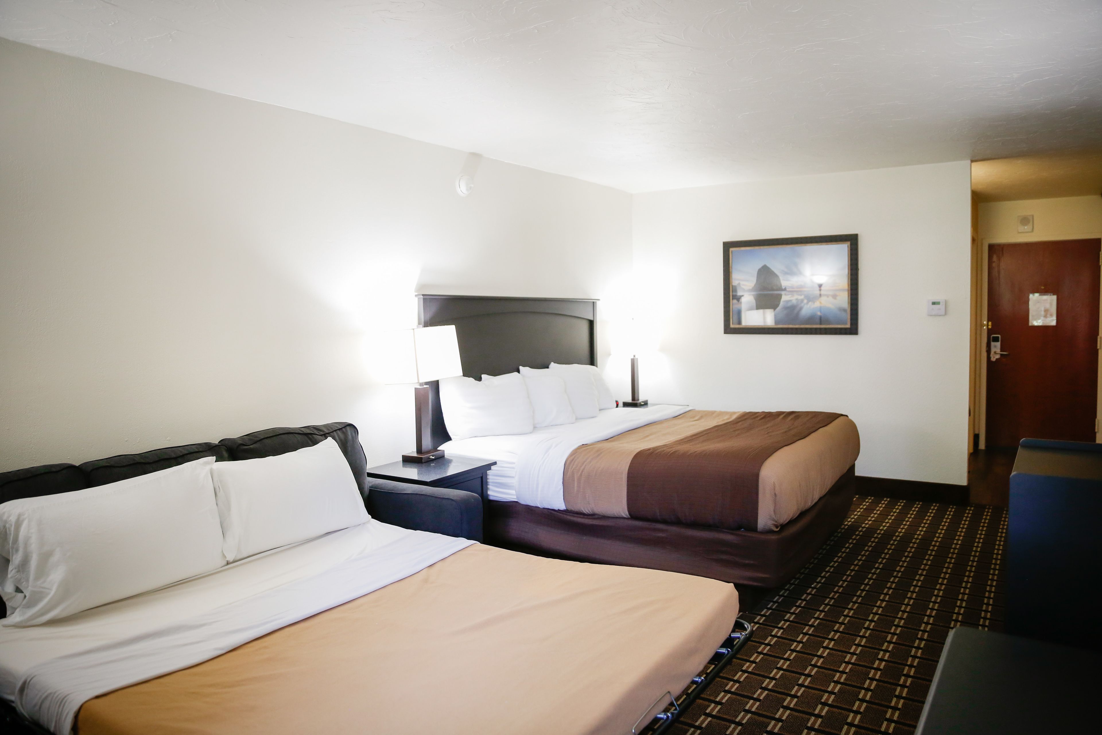 deluxe room | pillow-top beds, blackout curtains, iron/ironing board