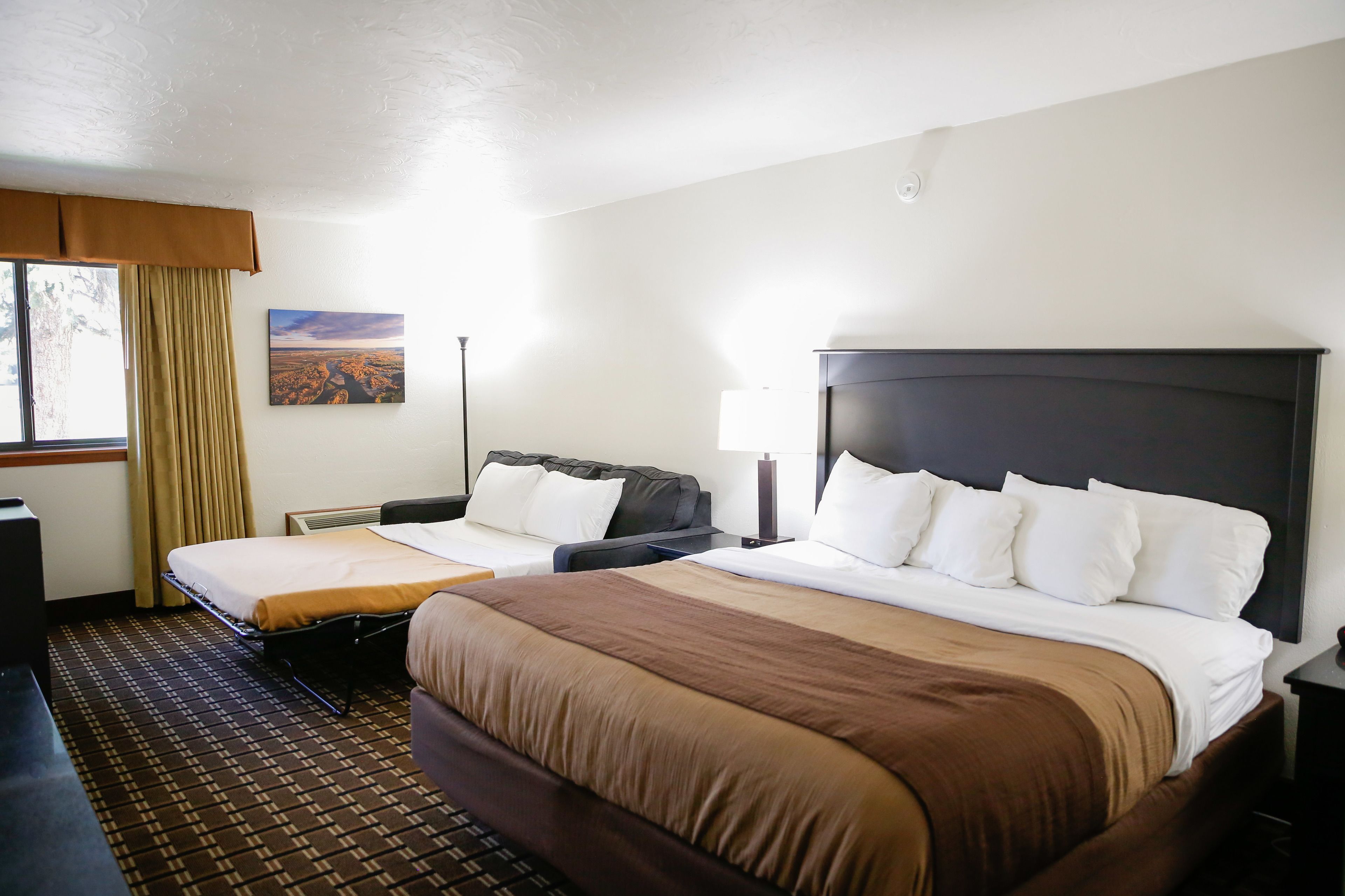 deluxe room | pillow-top beds, blackout curtains, iron/ironing board