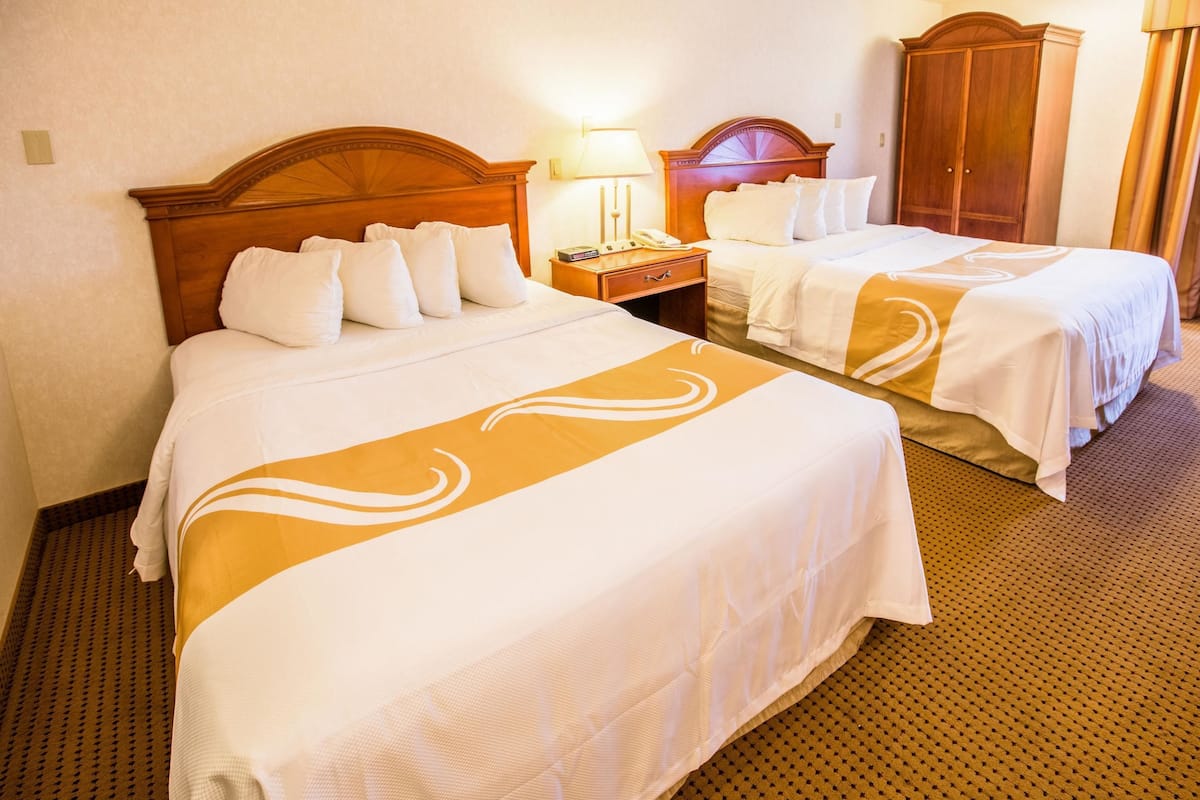 standard room, 2 queen beds, non smoking | premium bedding, in-room safe, blackout curtains, iron/ironing board