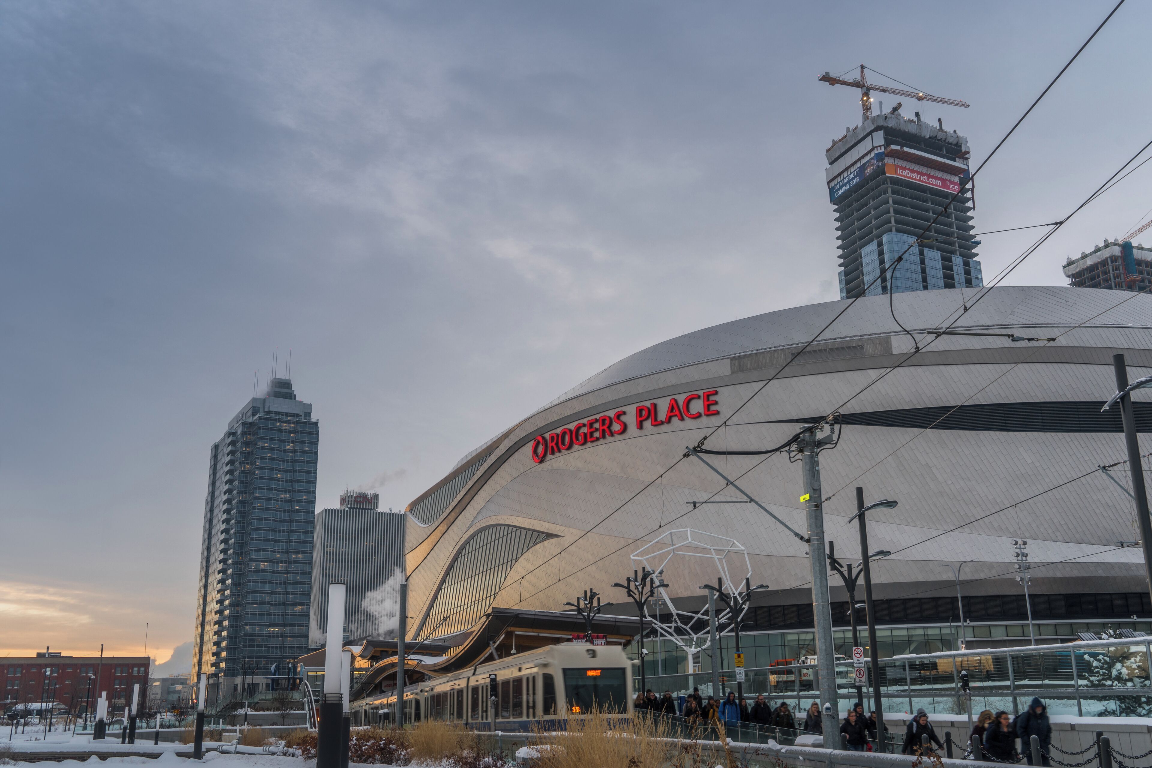 A modern building with a curved roof and the text "Rogers Place" on it.