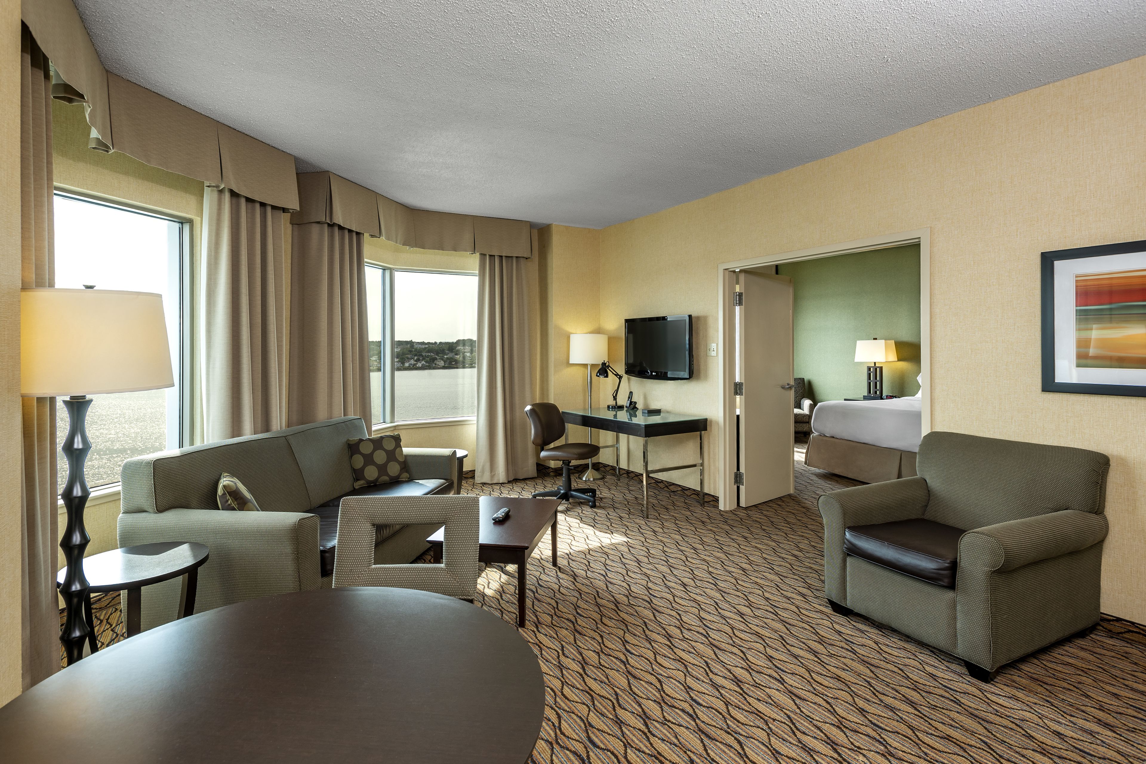 suite, 1 king bed with sofa bed | living area | 32-inch flat-screen tv with cable channels, tv, mp3 dock