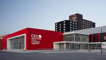 A modern building with a red facade and a sign for CEC.