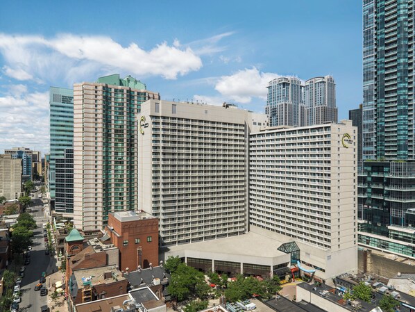 A high-rise hotel with multiple floors, a central courtyard, and a modern architectural design.