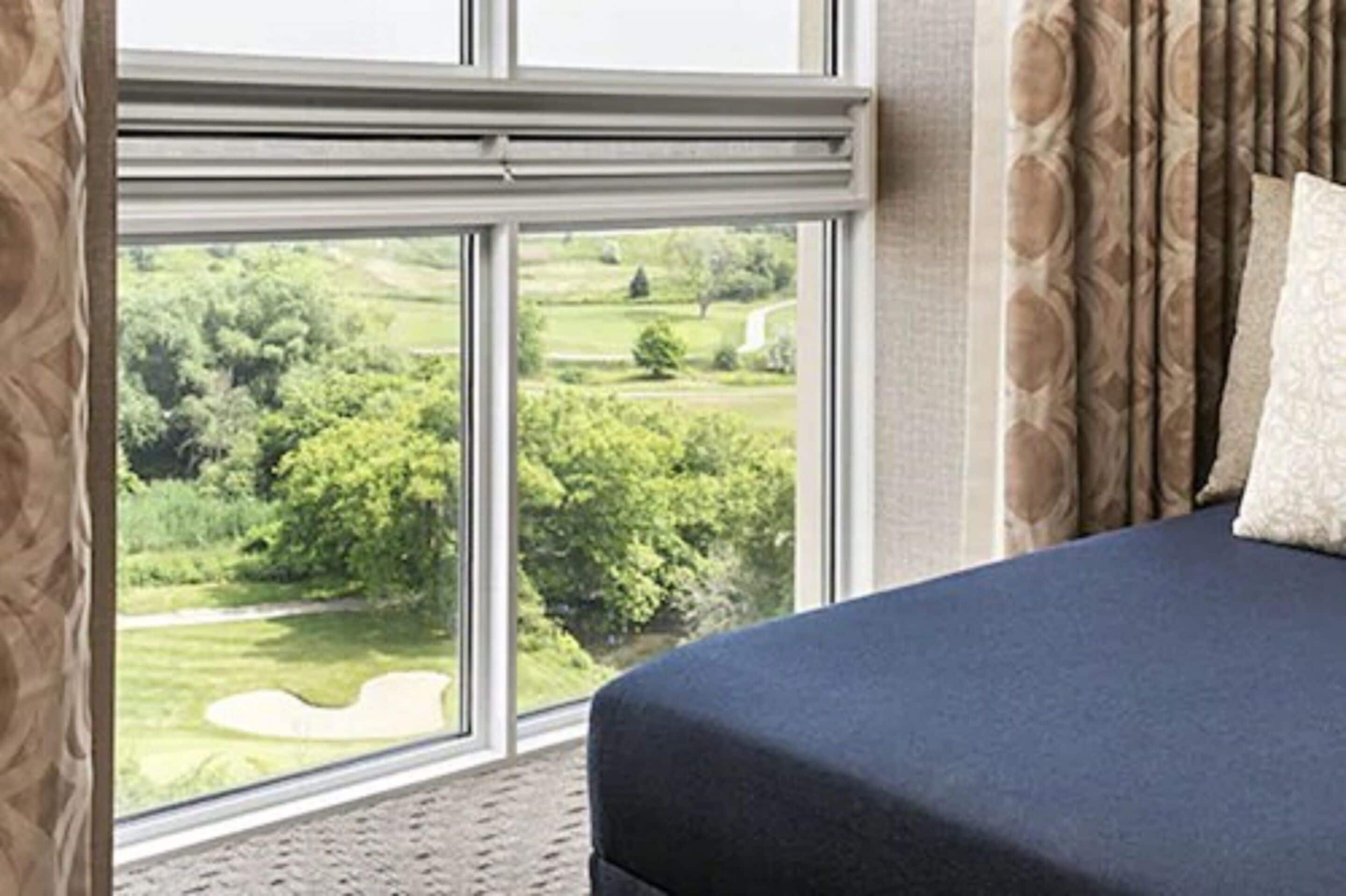 deluxe room, 2 queen beds, non smoking (view) | premium bedding, down duvets, in-room safe, desk