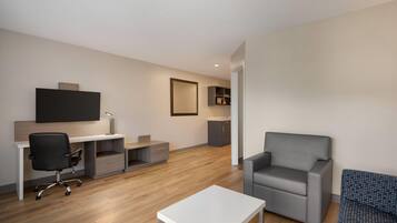 Suite, 1 King Bed, Non Smoking (1 Bedroom) | Laptop workspace, blackout curtains, iron/ironing board, free WiFi