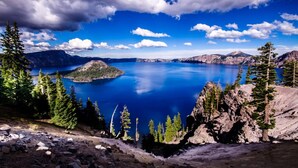 A mountainous landscape with a lake, trees, and rocky terrain. - Days Inn by Wyndham Medford (Medford)