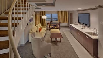 Suite, 1 King Bed, Non Smoking | Living area | 55-inch LCD TV with satellite channels, TV