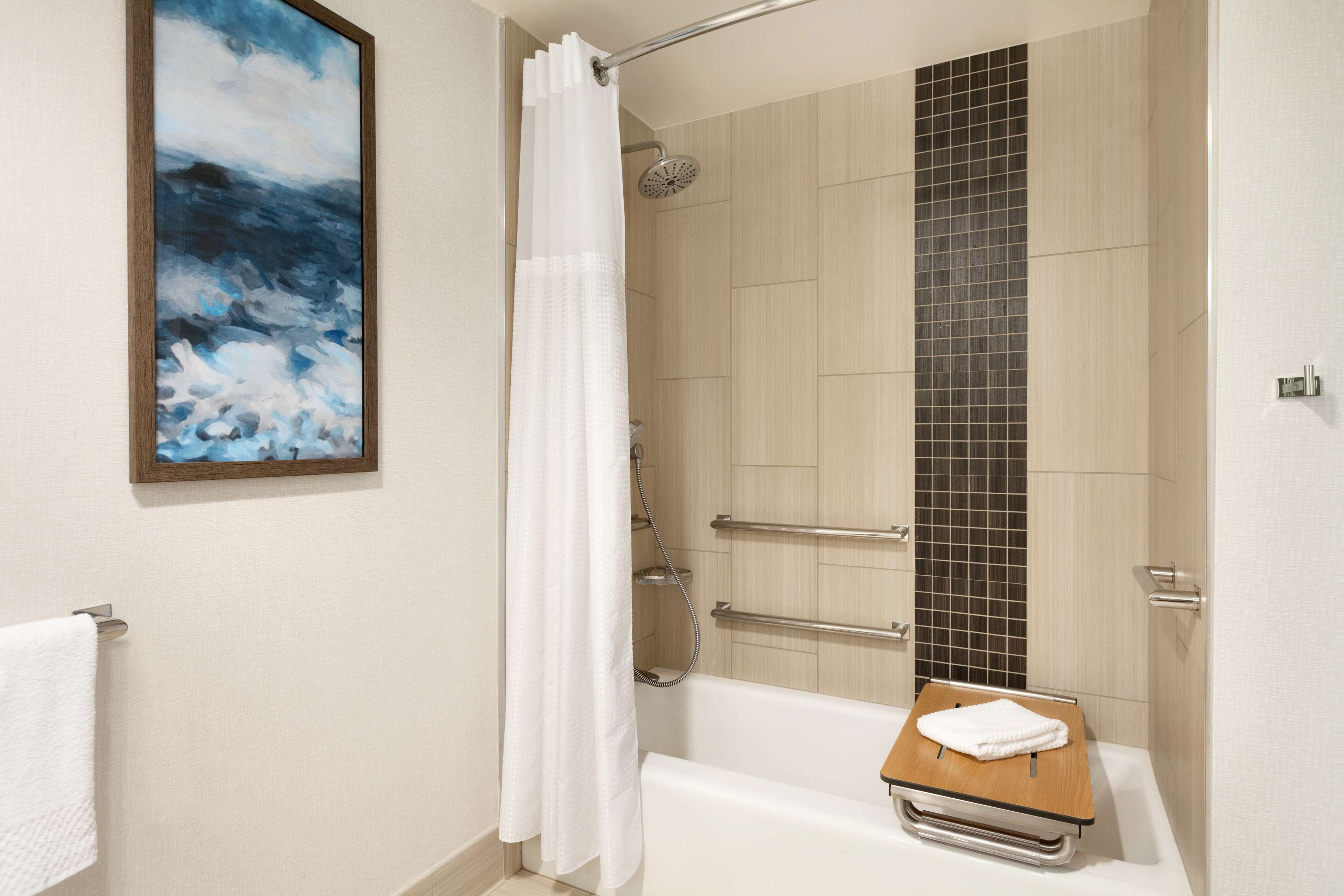 combined shower/bathtub, designer toiletries, hair dryer, towels