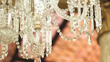 A chandelier with multiple crystal elements.
