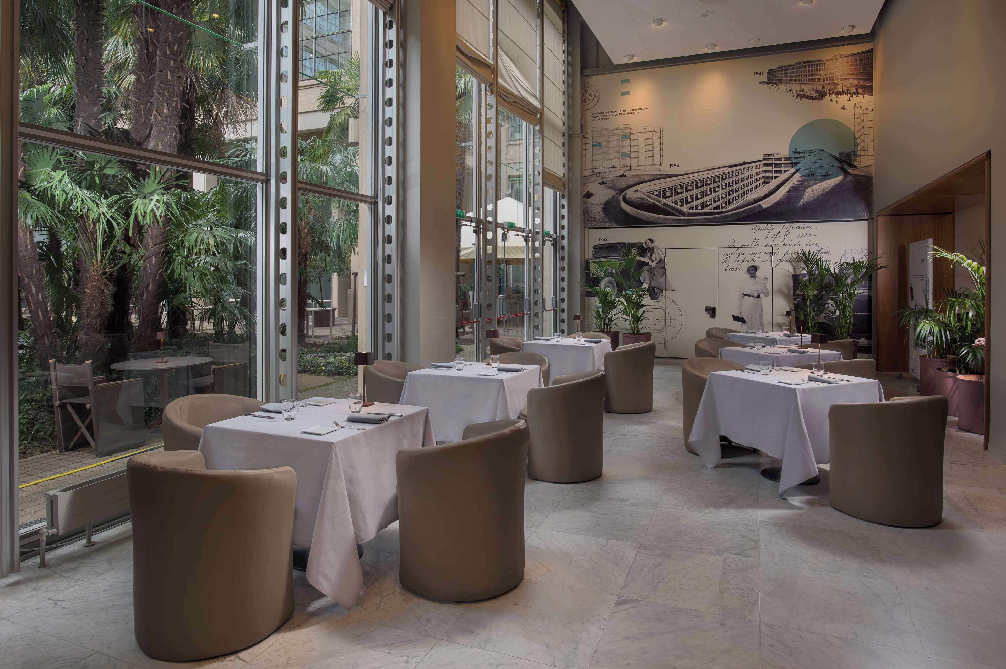 Lunch, dinner served; international cuisine, garden views 