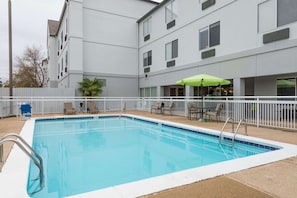 Outdoor pool, open 9:00 AM to 9:00 PM, pool loungers