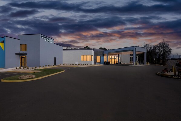 A modern building with a sign reading "CONFERENCE SELECT" and a covered entrance. - Sonesta Select Hotels Statesville (Statesville)