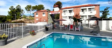 Outdoor pool, open 10:00 AM to 8:00 PM, pool umbrellas, sun loungers