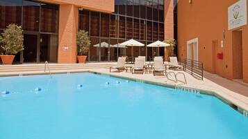 Outdoor pool, open 9:00 AM to 10:00 PM, sun loungers