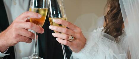 A couple toasting with champagne glasses.