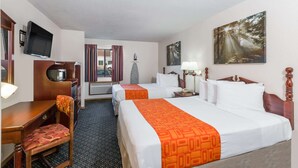 A hotel room with two beds, a desk with a chair, a television, a painting, and a window with curtains. - Howard Johnson by Wyndham Wichita Airport (Wichita)
