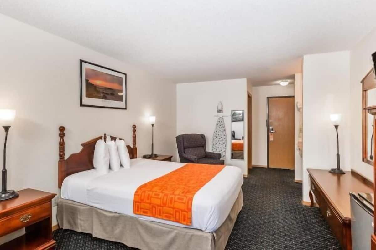 Premium bedding, desk, laptop workspace, blackout drapes