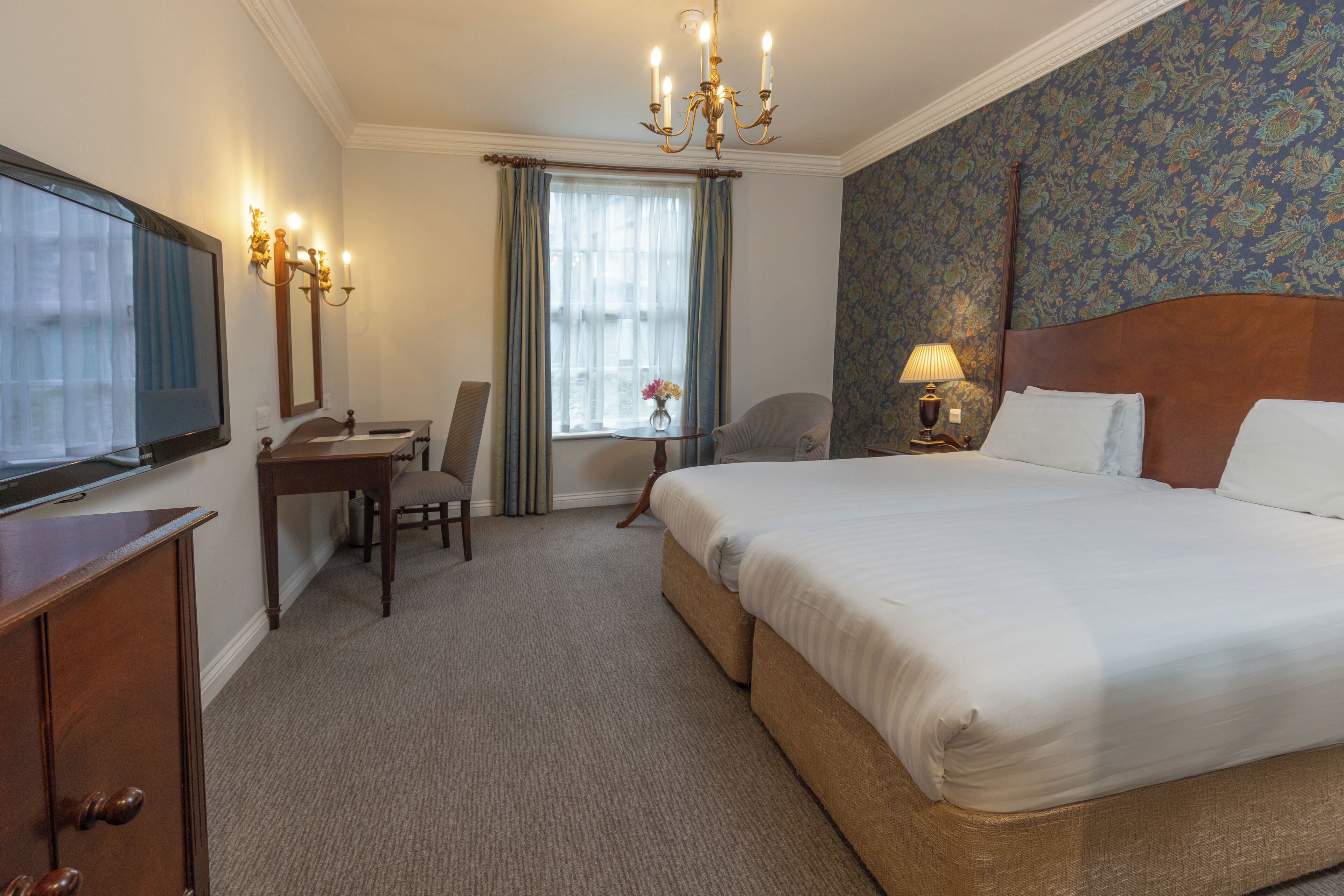 Individually decorated, desk, iron/ironing board, cots/infant beds