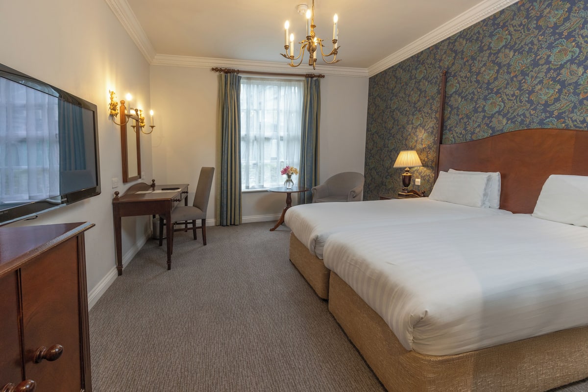 Individually decorated, desk, iron/ironing board, cots/infant beds