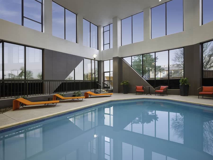 Indoor pool, open 11:00 AM to 11:00 PM, pool loungers