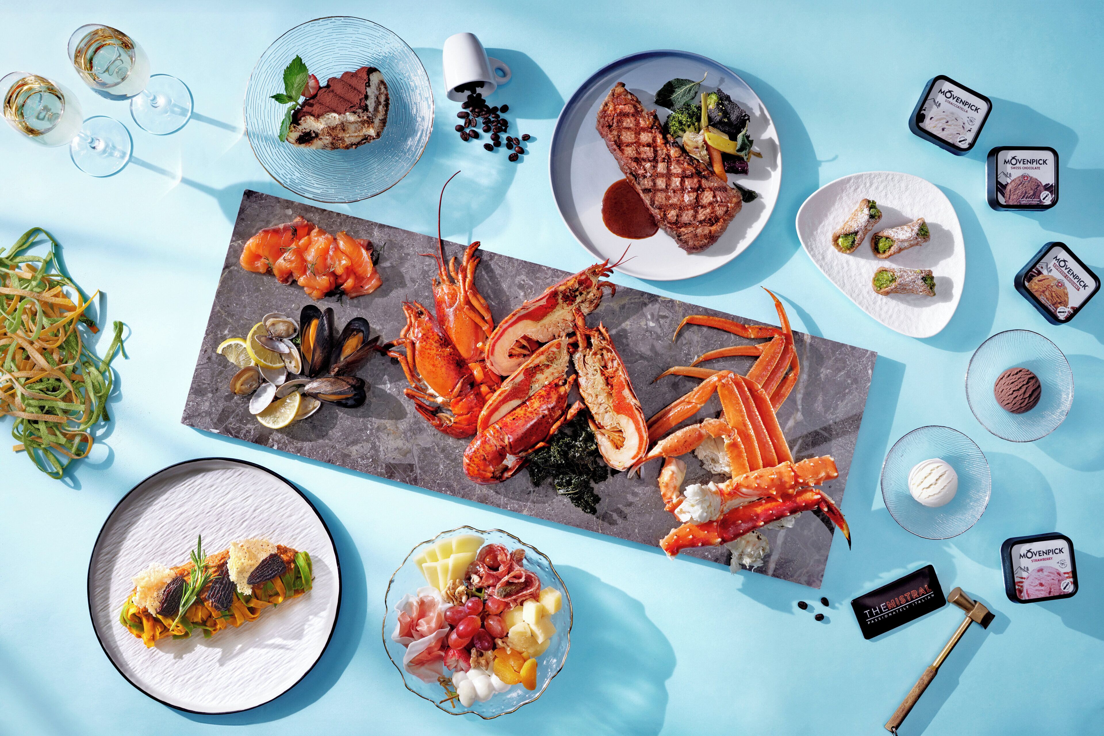 A variety of food items and a hammer on a table.