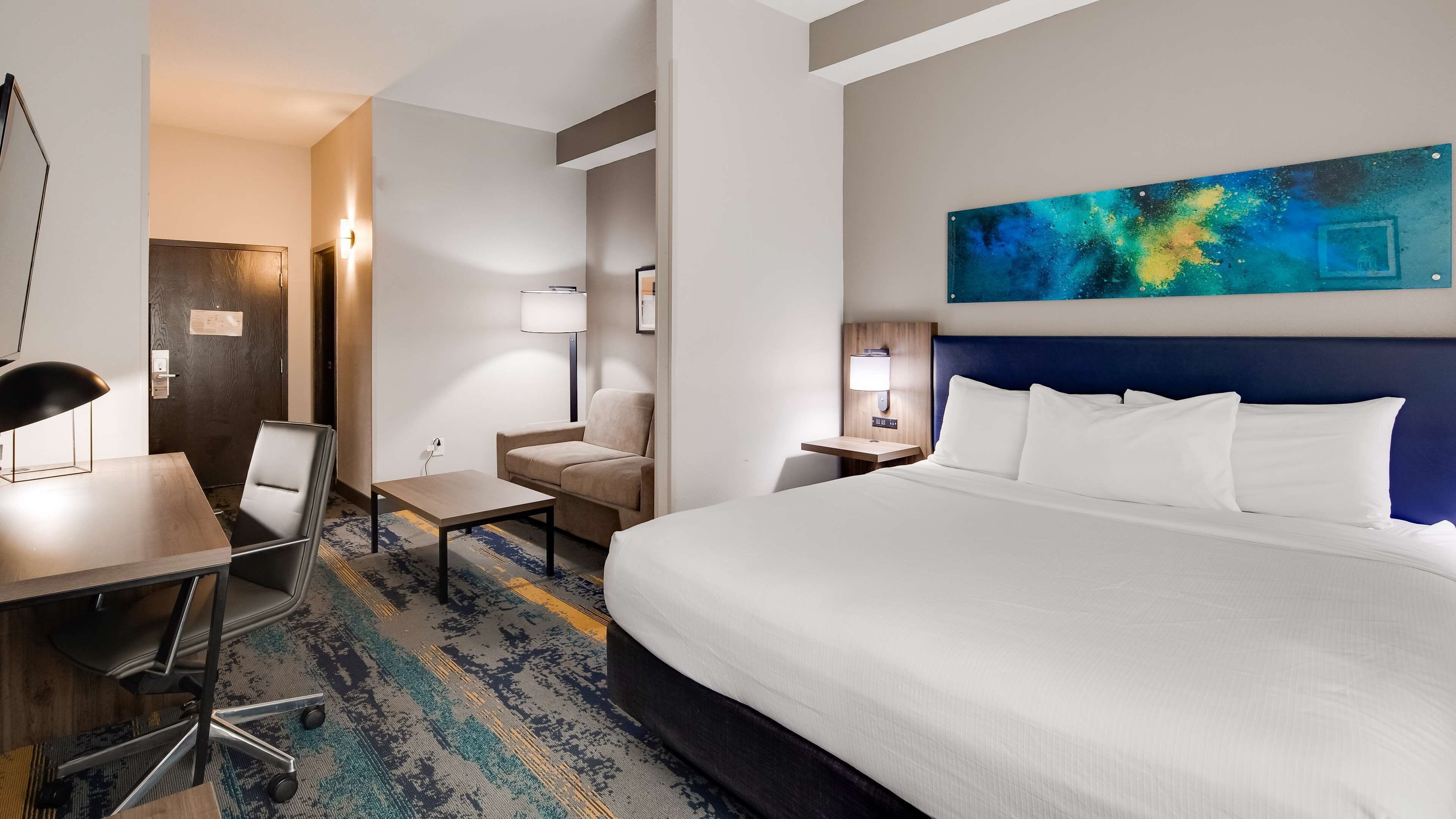 Desk, laptop workspace, blackout drapes, iron/ironing board