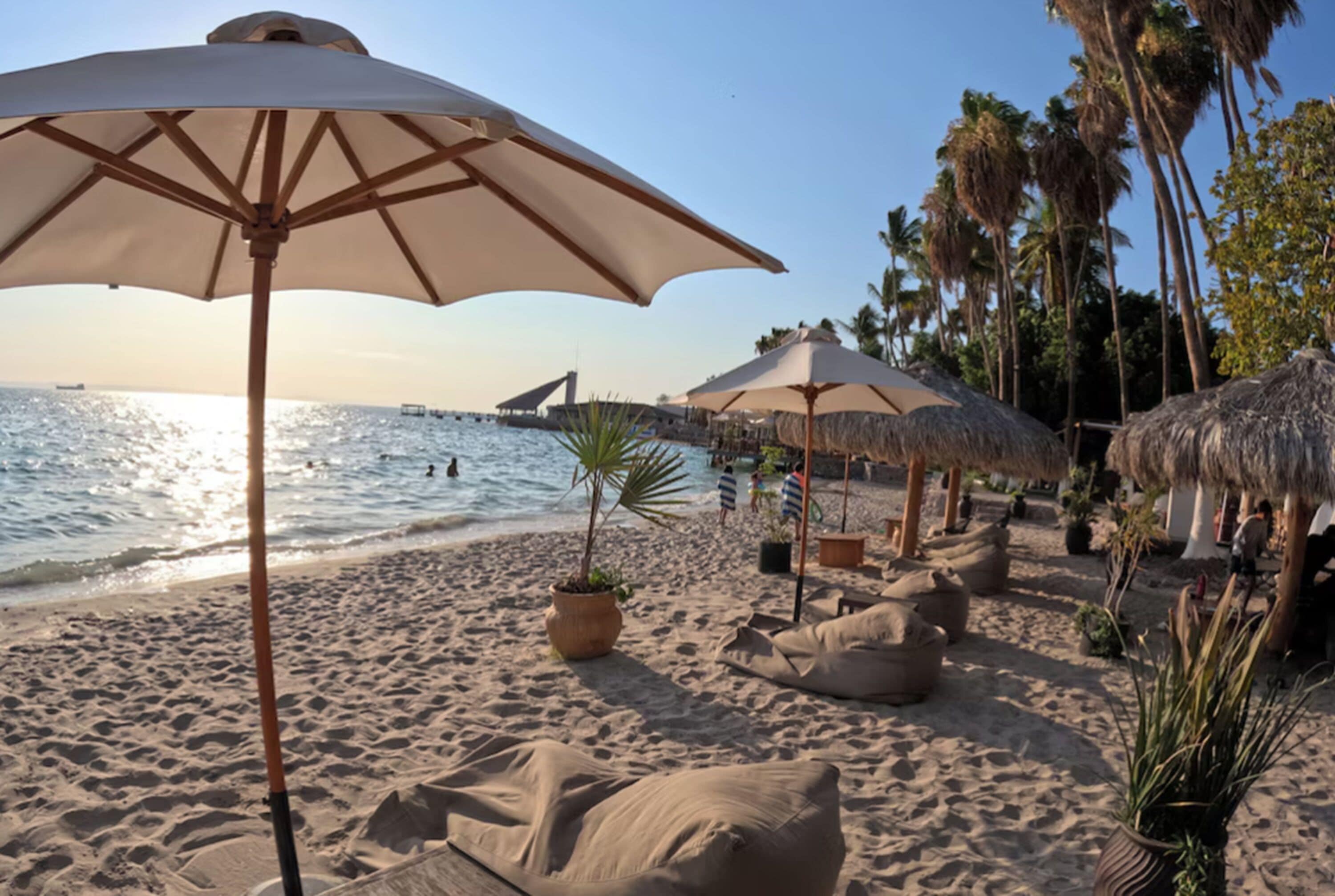 Private beach, beach umbrellas, beach towels, kayaking