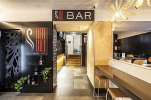 A bar area with a sign reading 'RED BILL BAR,' a reception desk, and a staircase leading to another floor.