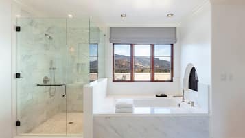 Separate bathtub and shower, designer toiletries, hair dryer, bathrobes
