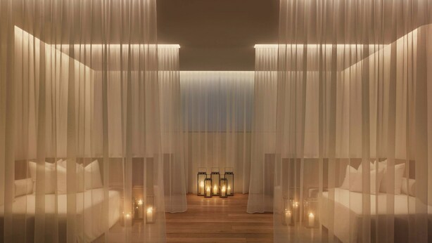A room with two beds, sheer curtains, and multiple wall-mounted lanterns. - The Miami Beach EDITION (Miami Beach)