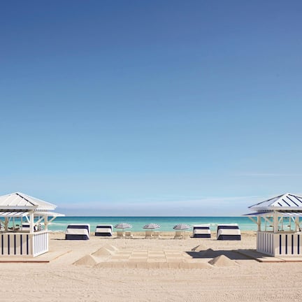 On the beach, beach cabanas, sun loungers