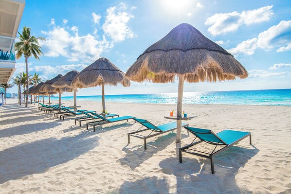 Private beach, white sand, beach cabanas, sun loungers