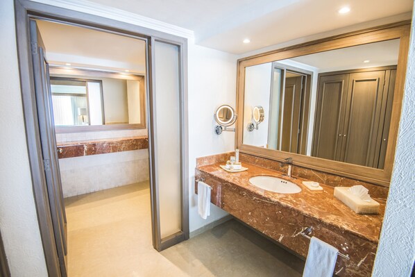 A modern bathroom with a marble vanity, two sinks, a large mirror, and a walk-in shower. - Sunscape Cancun All-Inclusive Resort & Spa by Hyatt (Cancun)