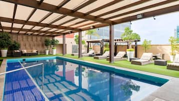 Outdoor pool, open 6:00 AM to 10:00 PM, pool loungers