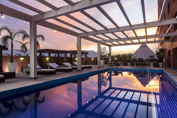 Outdoor pool, open 6:00 AM to 10:00 PM, sun loungers