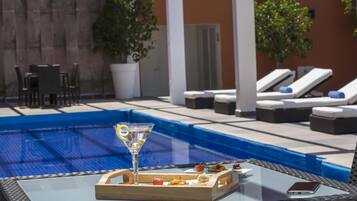 Outdoor pool, open 6:00 AM to 10:00 PM, pool loungers