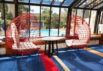 Sitting area in hotel lobby at Four Points by Sheraton Los Angeles International Airport
