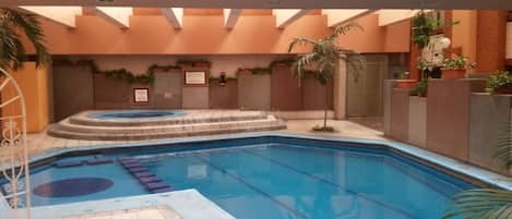 Indoor pool, outdoor pool, open 9 AM to 9 PM, pool loungers