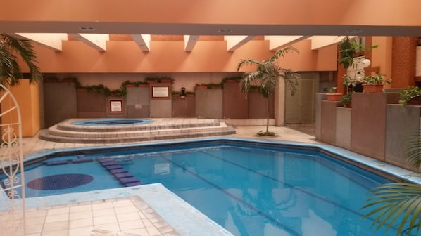 Indoor pool, outdoor pool, open 9 AM to 9 PM, pool loungers