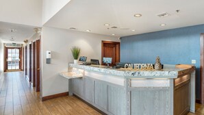 A reception area with a marble counter, a 'California' sign, and a plant. - Chase Suites Hotel Brea-Fullerton (Brea)