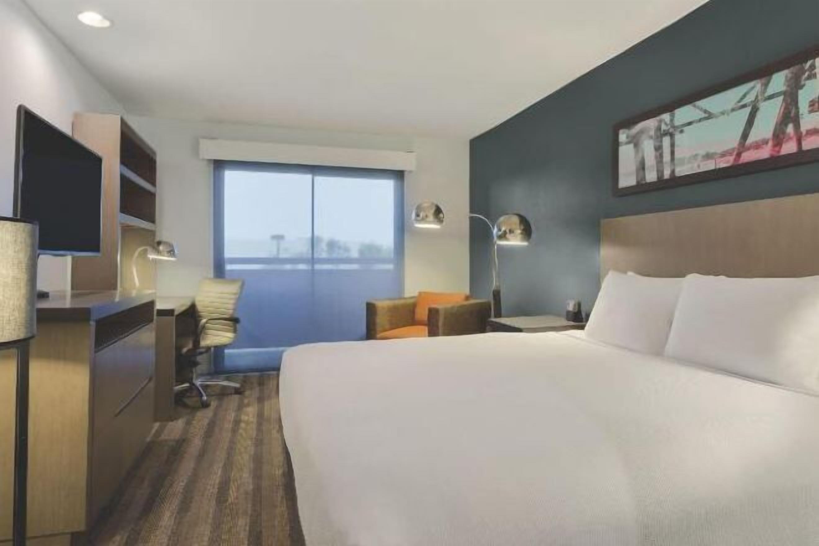 Down comforters, desk, blackout drapes, iron/ironing board