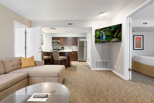 Deluxe Suite, 2 Bedrooms, Kitchen | Living area | 55-inch flat-screen TV with cable channels, TV, fireplace
