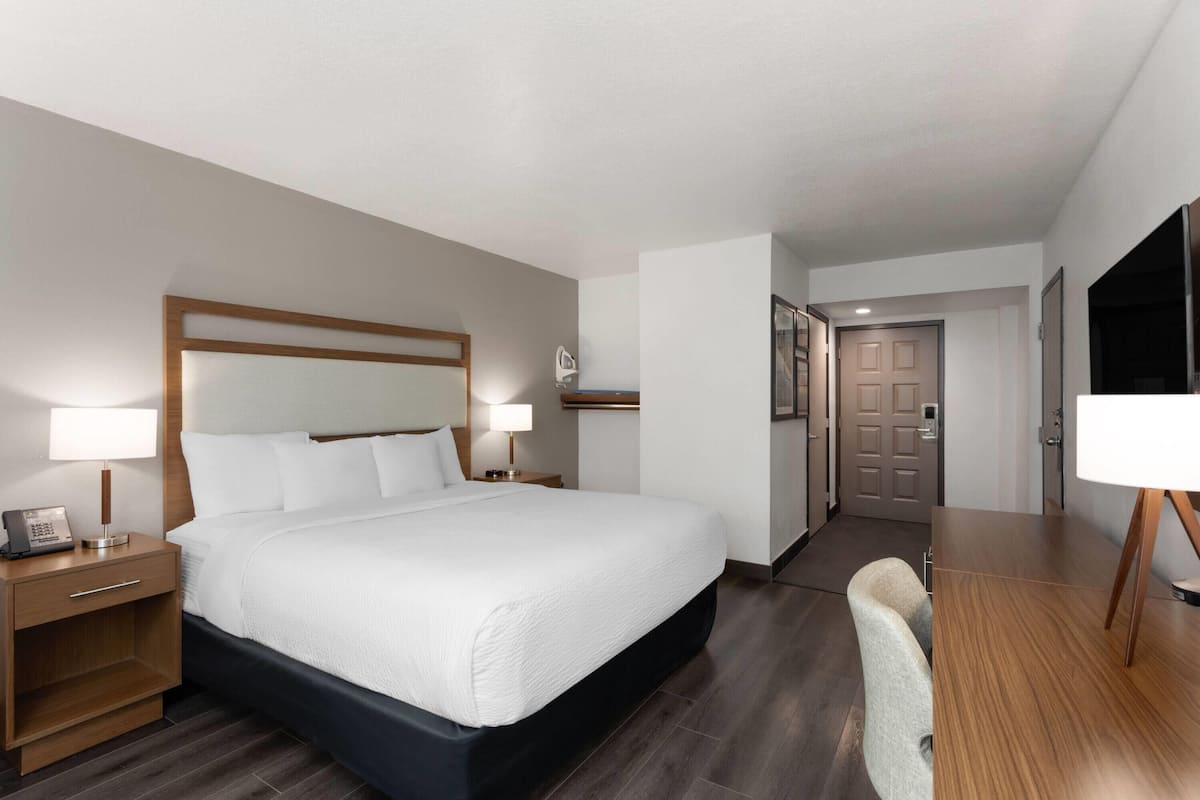 Room, 1 King Bed, Non Smoking (Mobility/Hearing/Roll-In Shower) | Pillow-top beds, desk, blackout curtains, iron/ironing board