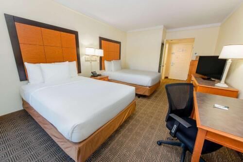 Pillowtop beds, desk, blackout drapes, iron/ironing board