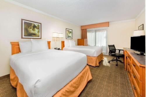 Pillowtop beds, desk, blackout drapes, iron/ironing board