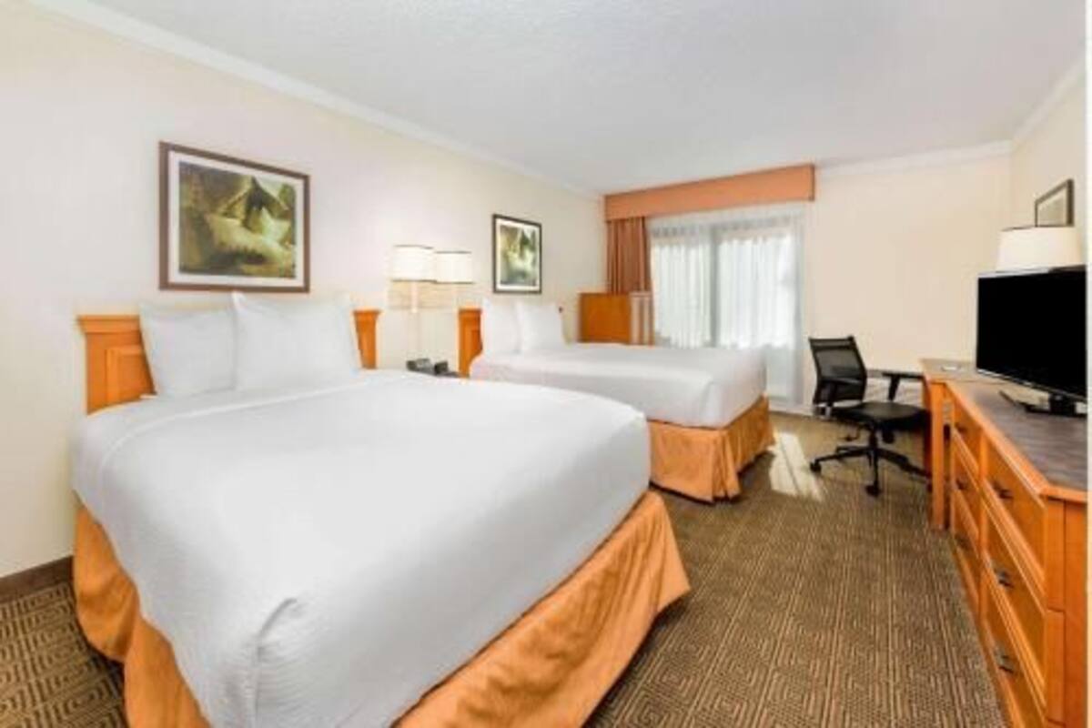 Pillowtop beds, desk, blackout drapes, iron/ironing board