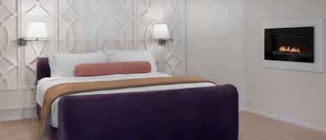 A modern bedroom with a large bed, two wall-mounted lamps, and a fireplace.